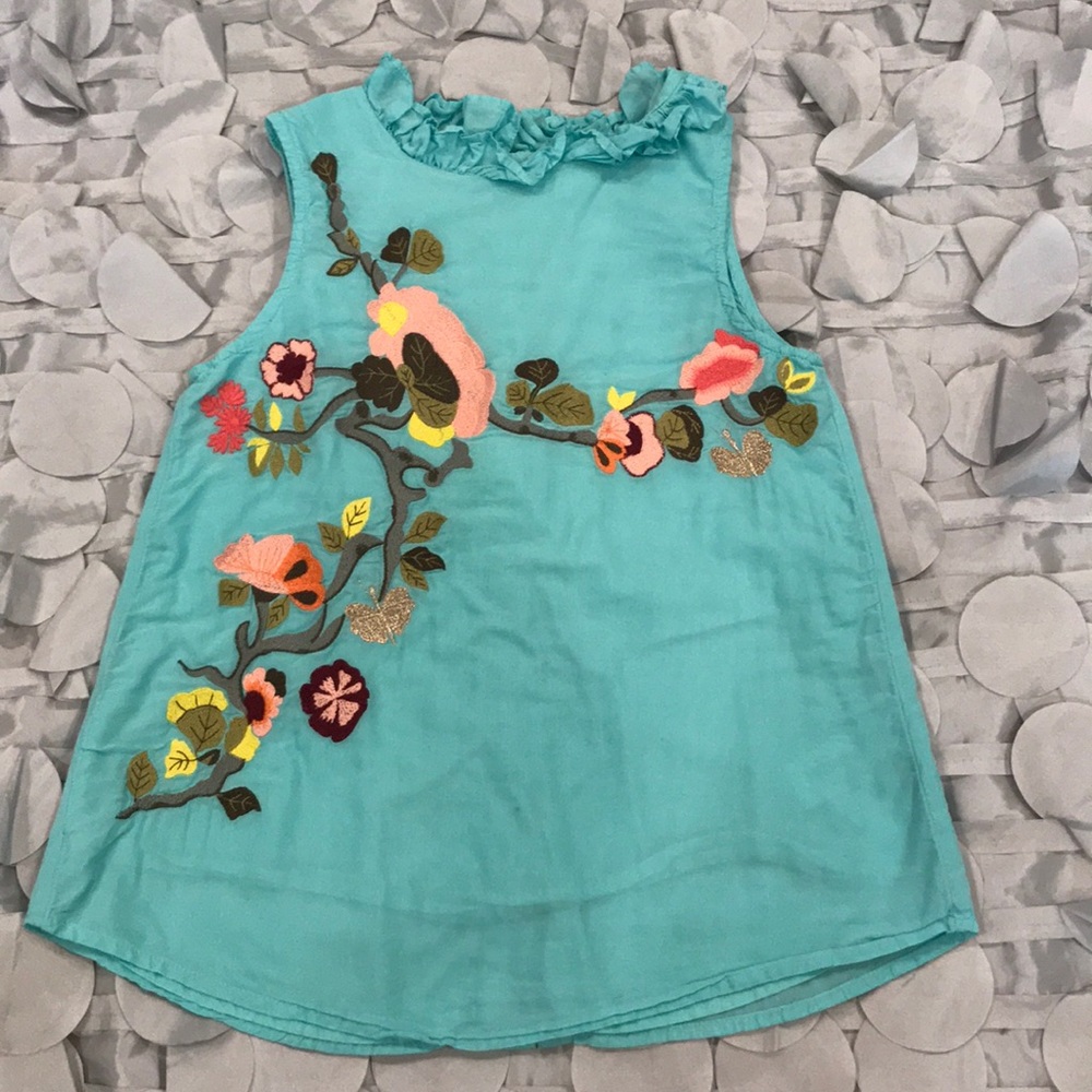 Beautiful embroidery sleeveless top in aqua color.